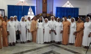 The migrant girl who received First Holy Communion is with Sr. Eileen, Holy Cross Provincial, Sr. Asha and Sisters